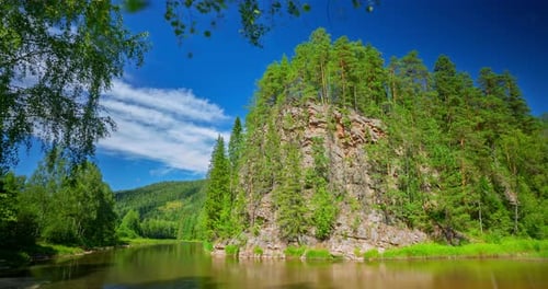 A Timelapse of a Mountain River and Clouds