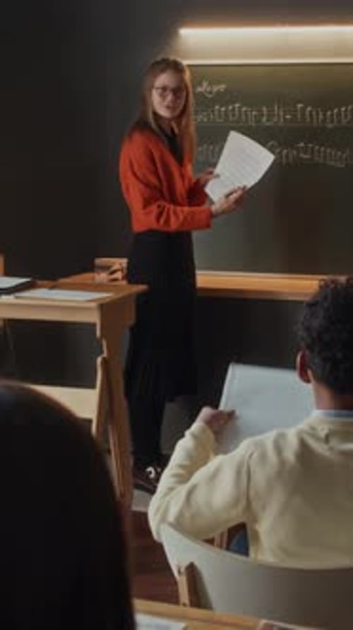 Young Teacher Explaining Elementary Students How to Read Music Notes