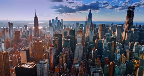 Dazzling sun lighting the tops of the skyscrapers in New York downtown.