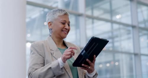 Tablet, business and senior woman in office online for social media, website review and planning