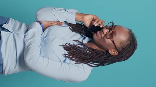 Woman With Dreadlocks Talking On Cell Phone