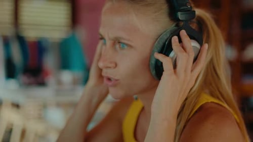 Cute Modern Woman Work on Computer in Headphones
