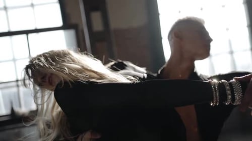 Dancing Couple Embrace in an Urban Setting