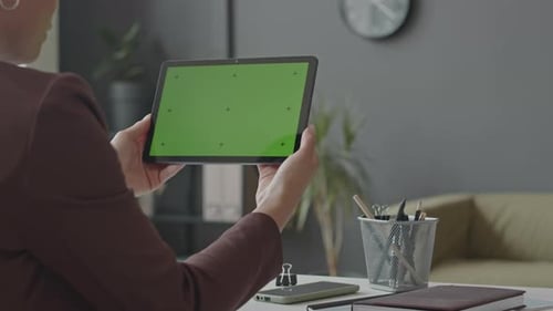 Businesswoman Using Digital Tablet with Chroma Key Screen