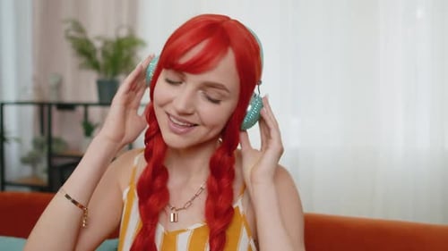 Smiling Woman Listening to Music on Headphones
