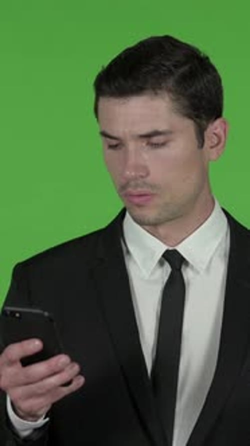 Handsome Businessman using Cellphone, Chroma Key, vertical video