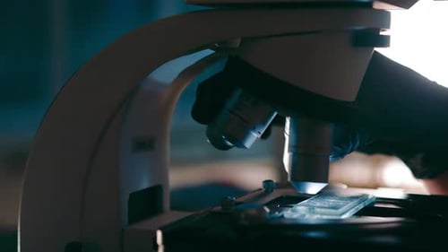Microscope in Laboratory Examining Glass Slide