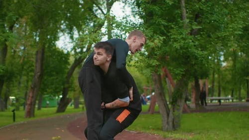 Sparring on Park Pathway Participants Practicing Combat Techniques Outdoors Two Fighters Practicing