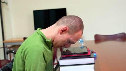 Man with Cerebral Palsy Studying in the University