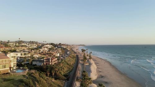 Aerial forward over San Clemente beach at sunset, California
