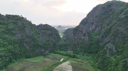 Scenic Tam Coc Valley Opening to Rice Fields in Ninh Binh Vietnam
