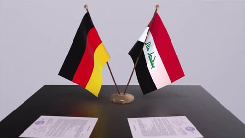 German and Iraqi Flags on Table With Signed Documents
