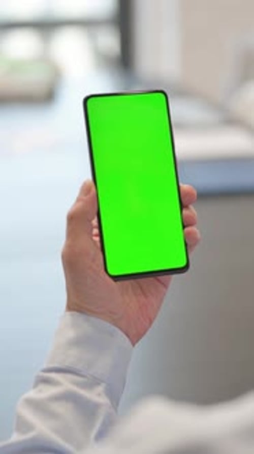 Senior Businessman Using Green Screen Phone