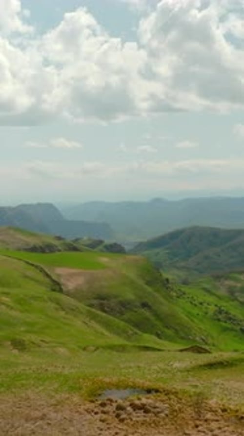 Top View of Hilly Mountains with Green Grass in Summer Shot Beautiful Green Mountain Slopes with