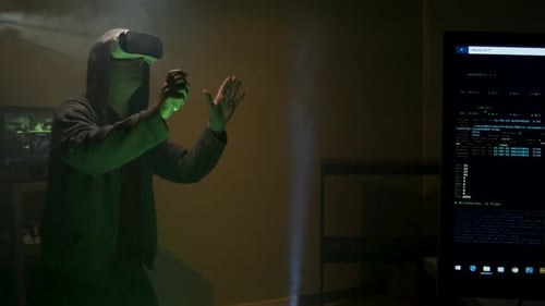 Hooded Figure Immersed in Virtual Reality Gaming