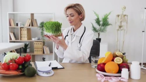 Woman Doctor Examining Fresh Greens in Office