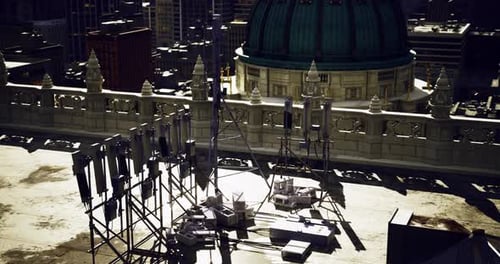 Urban Rooftop with Modern Equipment Overlooking a City Skyline at Sunset