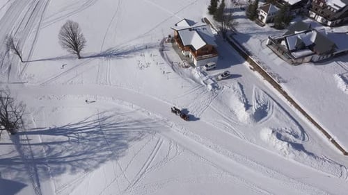 Aerial view of horse sleigh in winter snow mountain landscape, Styria, Austria.