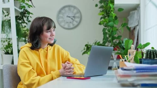 Woman Chatting on Laptop During Video Call