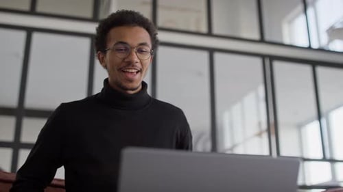 Man Talking On a Video Call In Office