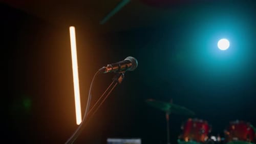 View of a Microphone on a Stand in a Nightclub with Some Light Beautiful Microphone Footage for