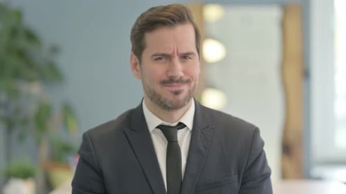 Man in Suit Looking at Camera