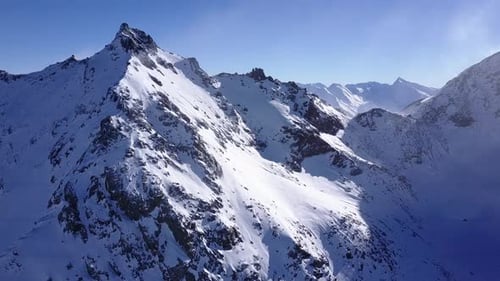 Aerial flight above stunning Alps.