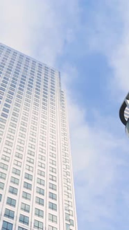 Bottom View of Modern Multistorey Buildings on Background of Blue Sky Action Simple Architecture of