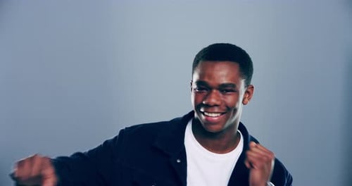 Enthusiastic Young Man Dancing with Joyful Energy