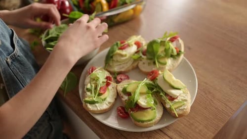 Preparing Healthy Sandwiches with Avocado and Spinach