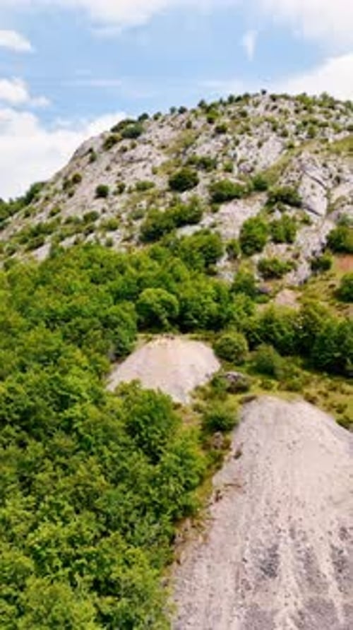 Approaching the rocks where a group of people stand. Rocky panorama of the nature of Spain, Europe