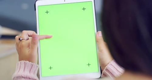 Woman Swiping Tablet With Green Screen Close Up