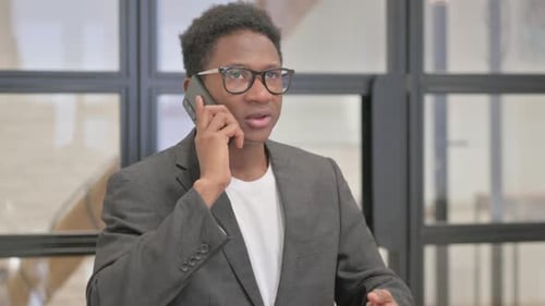 Young Adult on Phone in the Office