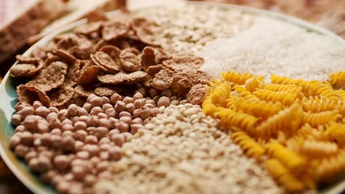 Uncooked Grains and Pasta on Plate Close-up