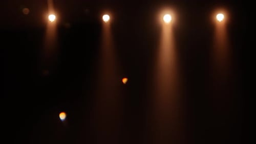 Beams of Light From Spotlight in Dark Studio with Smoke