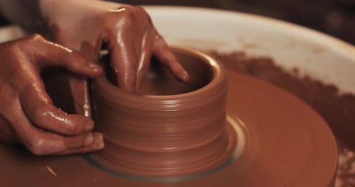 Potter Creating a Clay Pot Workshop of Clay Hands Working on Pottery Wheel Shaping a Clay Pot Red