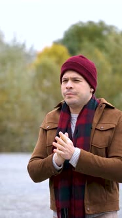 Man Coughing and Blowing Nose with Tissue Outside