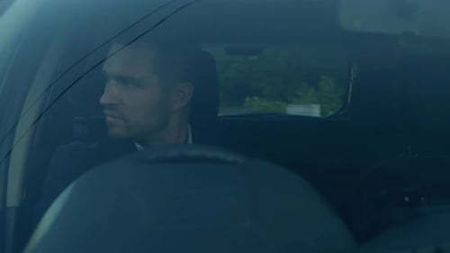 Young Businessman Using Seatbelt While Driving Car Right Hand Drive Car View Through the Windshield