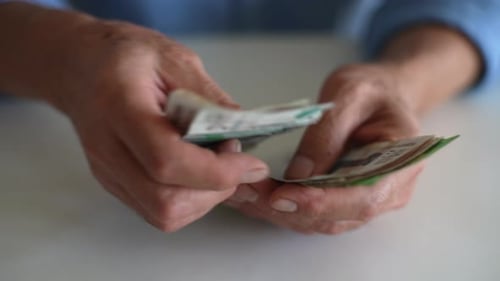 Hands Counting Money Close Up