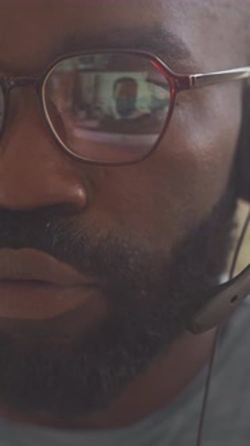 Black Man Video Conferencing with Colleague Half Face
