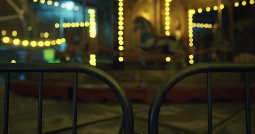 Empty Carnival Atmosphere with Lights and a Carousel at Night