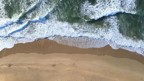 Aerial View of Waves Seen Rushing to Shoreline