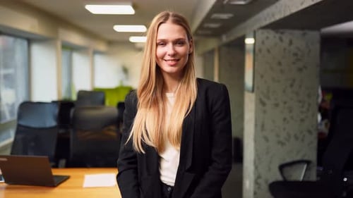 Smiling Caucasian Business Woman in Formal Outfit Looking at Camera Standing in Office Portrait of