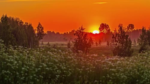 Misty rural landscape and bright majestic sunrise, time lapse
