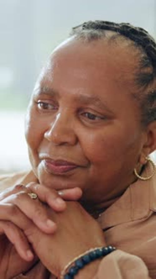 Memory, reflection and thinking with senior black woman in home for contemplation or recollection