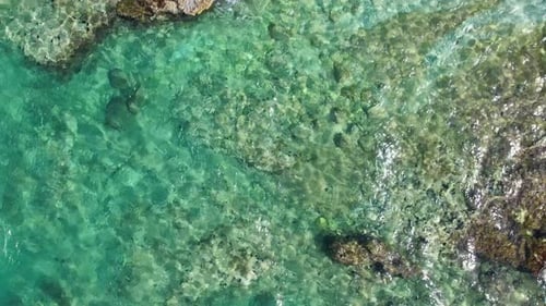 Aerial Top View of Turquoise Sea Waves Small Waves Calmness and Relaxation