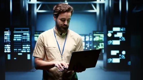 System Administrator Monitoring Energy Use Across Server Racks
