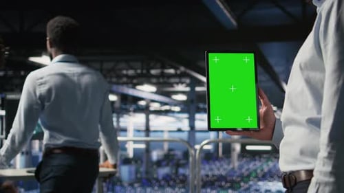Close Up of Data Center Admin Using Mockup Tablet to Update Software