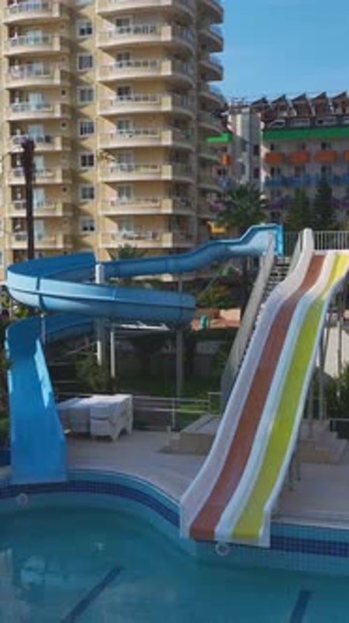 Vertical Video Scenic Summer Pool in a Luxury Complex with Crystal Clear Water and a Relaxing