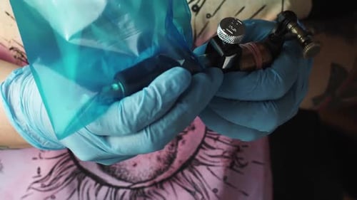 Tattoo artist preparing the tattoo on a professional way